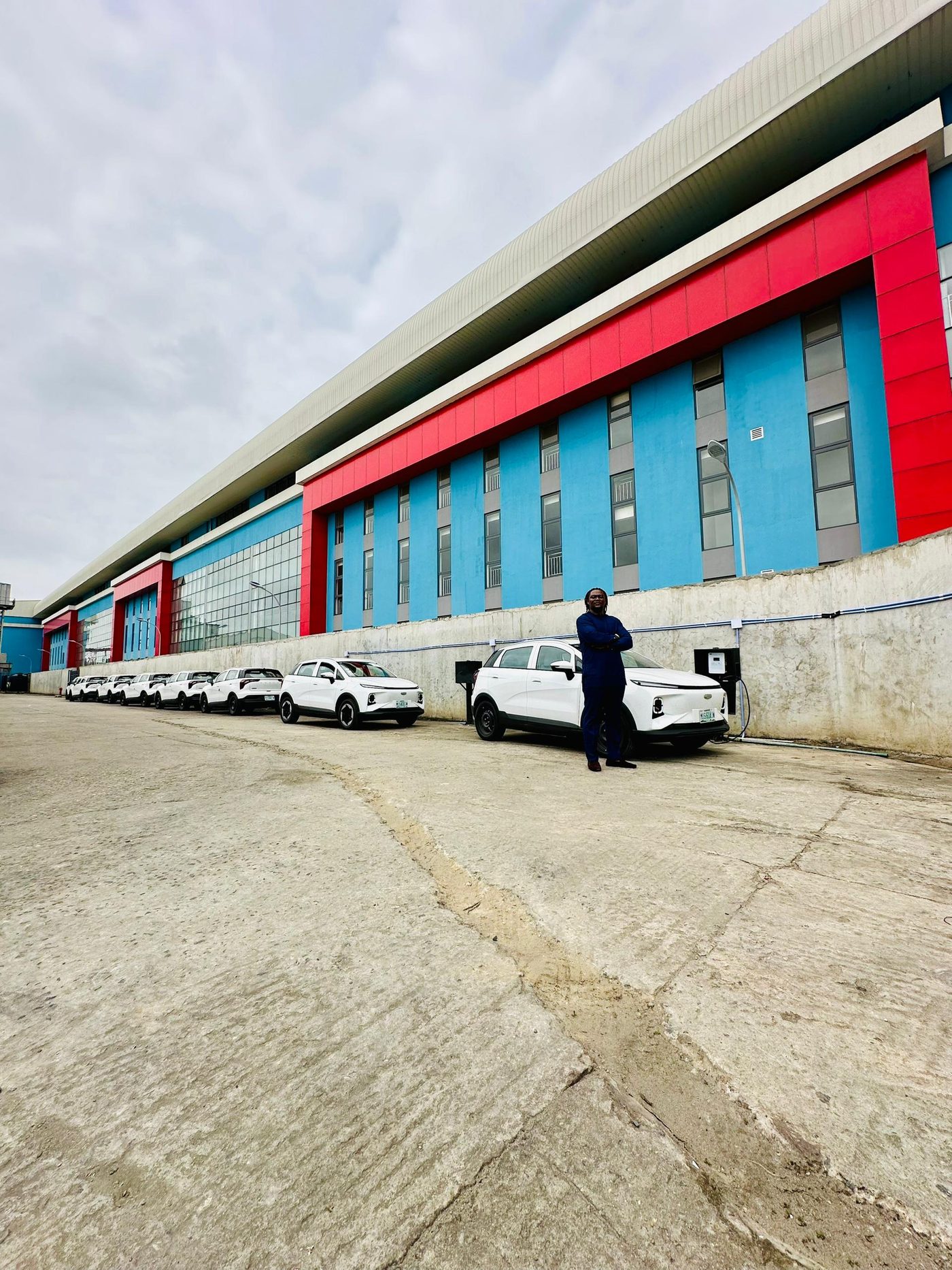 Standing with the EV fleet outside the plant